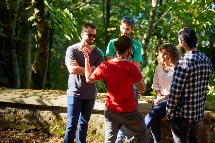 a group of people standing in a park